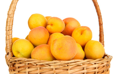 Fresh natural apricot in wicker basket isolated on white