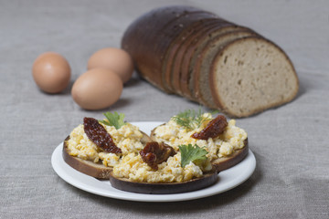 a classic, simple breakfast: scrambled eggs on toast