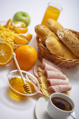Breakfast with coffee, honey,  juice, fruits, egg