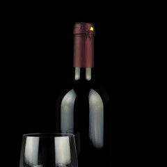 Studio shot of wine glass and a bottle