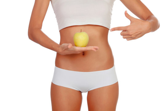 Girl in white underwear with a apple