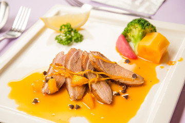 Duck chest roasted with orange sauce Chinese style food