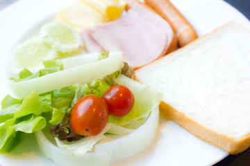 breakfast with  sausage ham , toast, salad