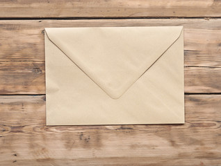 brown letter on wooden table