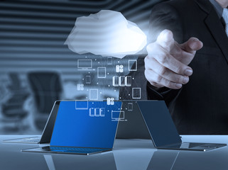 Businessman working with a Cloud Computing diagram on the new co