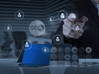 businessman hand showing search engine optimization SEO