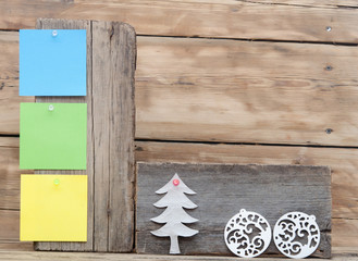 colorful reminder notes attached on a old wooden signboard with