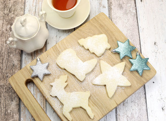 Homemade Christmas shortbread biscuit and cup of tea