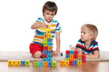 Boys with blocks on the floor