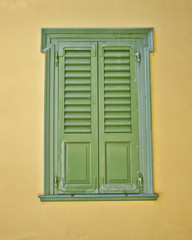 green window, ocher wall