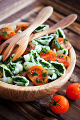 Cherry tomatoes with gluten-free pasta and spinach sauce