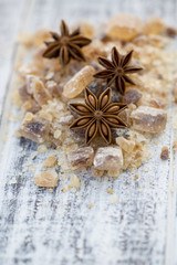 Fototapeta premium Star anise on brown sugar, Christmas spices