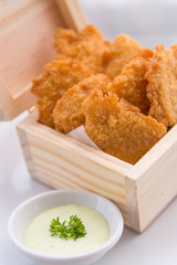 Crisp fish finger nugget in wooden box