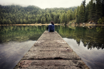 Lonely girl on a pier