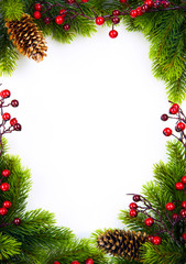 Fototapeta na wymiar art christmas frame with fir and Holly berry on white paper ba