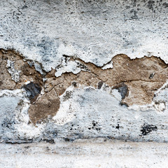 wall with a huge crack on plaster