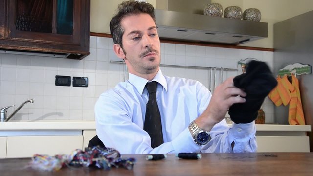 businessman darning socks