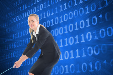 Composite image of businesswoman pulling a rope