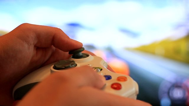 Man playing video game with a joystick