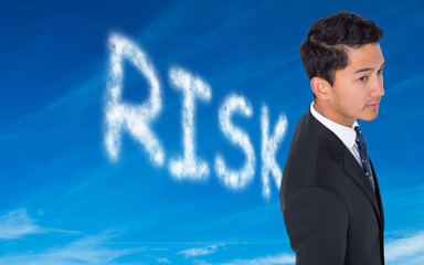 Composite image of serious asian businessman