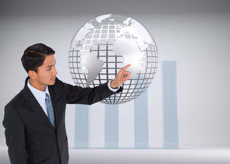 Composite image of stern asian businessman pointing