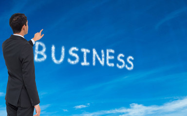 Composite image of asian businessman pointing