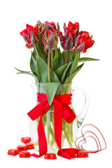 spring red tulip flowers in vase with hearts