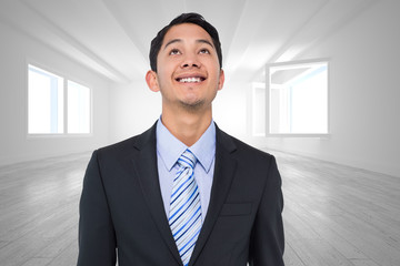 Composite image of smiling asian businessman