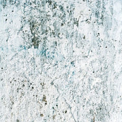 blue texture or background wall of shabby paint and plaster crac