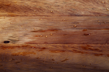 Wooden kitchen board with water drops
