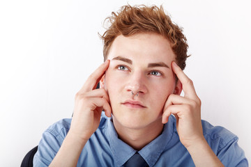 Young man while thinking