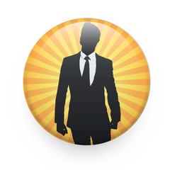 Silhouette of businessman printed on badge.