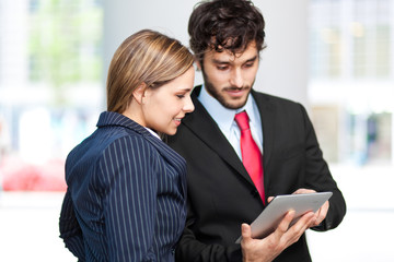 Business people using a tablet