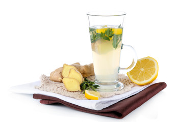 Cup of tea with ginger on napkin isolated on white