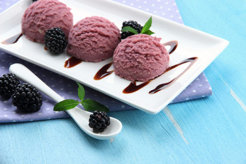 Delicious ice cream on plate on table close-up