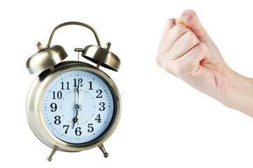 Alarm clock and hand isolated on white