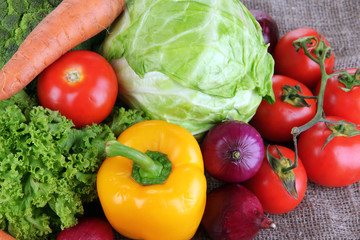 Fresh vegetables on burlap background