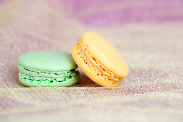 Macaroons on fabric background