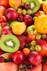 Foto op Plexiglas Vruchten Assortiment van sappige vruchten achtergrond