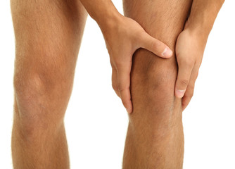 Young man with knee pain, isolated on white