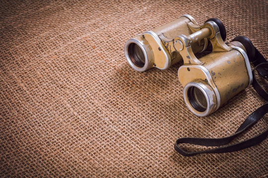 Old German Military Binoculars On Canvas Background