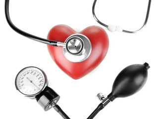 Tonometer, stethoscope and heart isolated on white