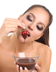 Portrait of beautiful young girl with strawberry in chocolate