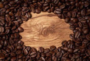roasted coffee beans on wooden texture