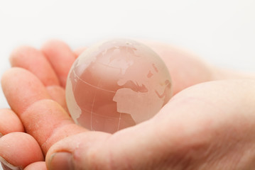 Glass globe in hands