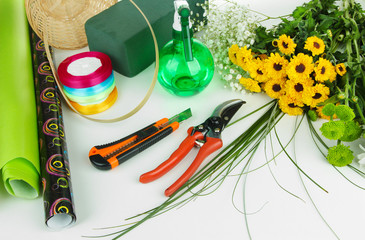Fototapeta na wymiar Composition with florist tools isolated on white