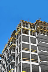 Building construction site work against blue sky