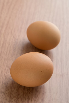 Two eggs on the  wooden table