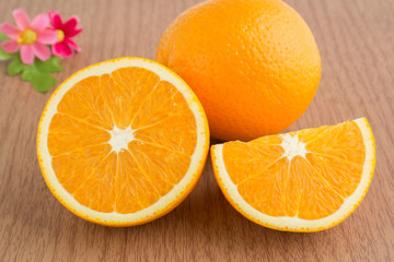 One orange and slices of orange