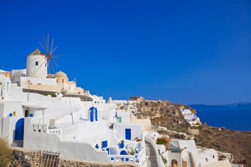 Fototapeta premium Windmill in Oia at Santorini island, Greece